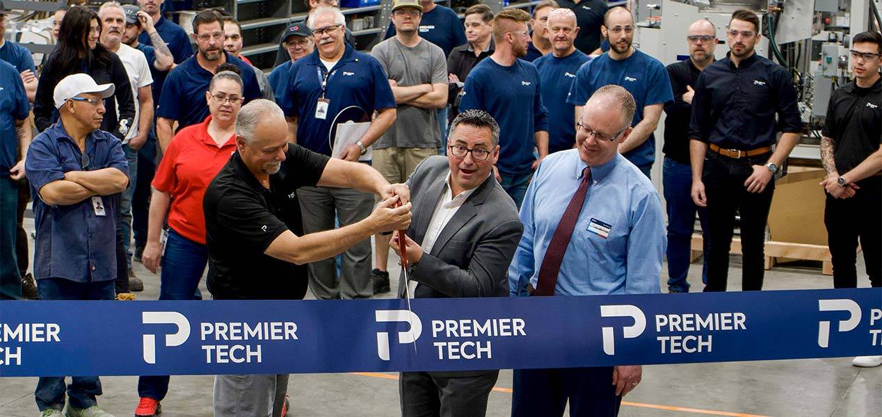 Premier Tech team members and Ryan Westergard, mayor of Wood Cross City cutting a ribbon.