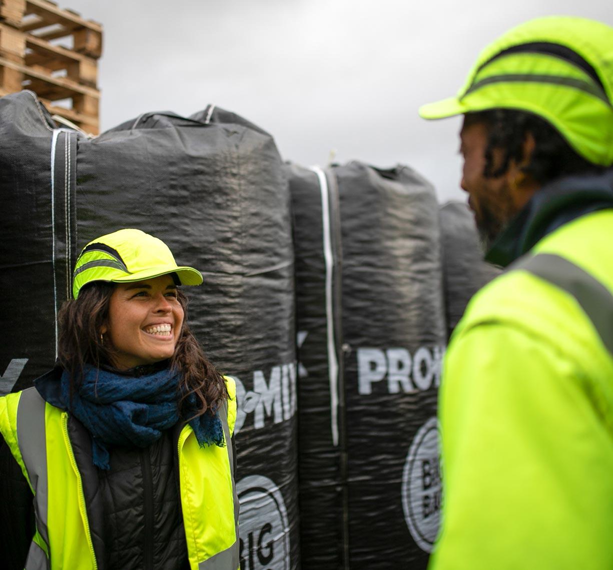 Team members near PRO-MIX bags